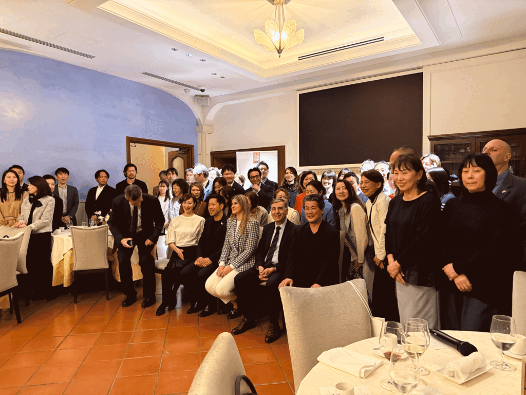 Group photo at a Foodex Japan 2025 trade dinner, with Greek and Japanese participants attending a networking hospitality event.