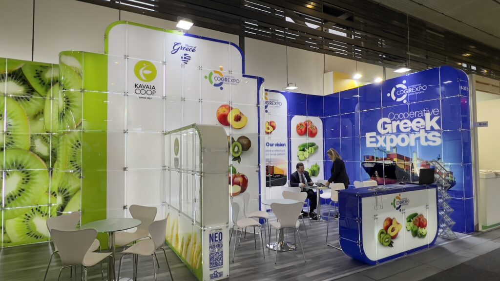 Cooperative Greek Exports booth at Fruit Logistica Berlin showcasing fresh produce.