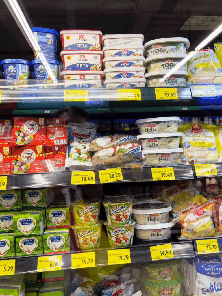 Greek dairy products on shelf in Dubai supermarket during market visit