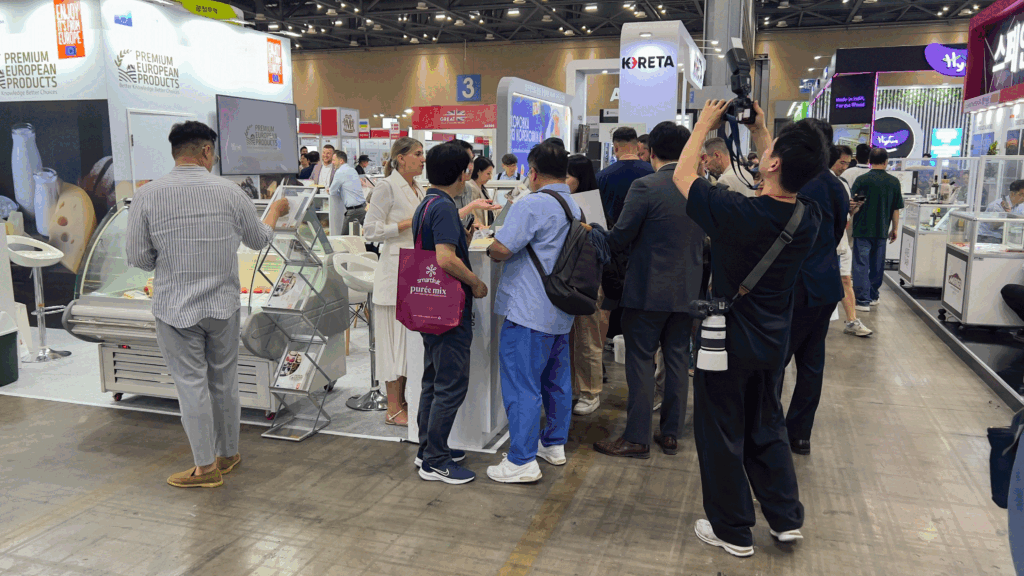 Visitors and media capturing product tastings at the Premium European Products stand during Seoul Food 2025.