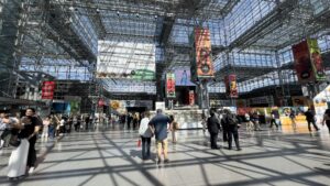 Interior of Javits Center during Summer Fancy Food Show 2025 with visitors walking through the main exhibition hall.