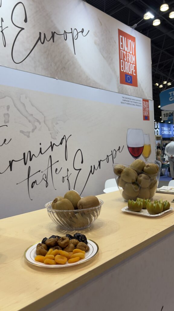 Display of kiwis and dried fruits at the EU booth during the Summer Fancy Food Show 2025 in New York.