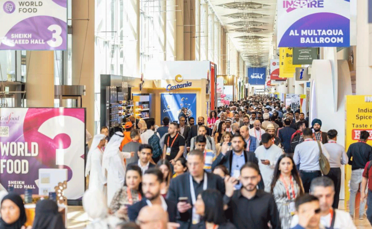 Crowded hallway at Gulfood Dubai 2025 with international buyers and exhibitors walking through the main World Food corridor.