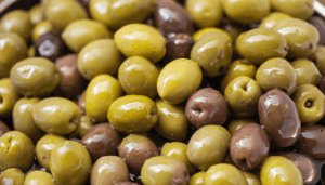 Close-up of mixed Mediterranean olive varieties — symbolising the diversity and authenticity of single-variety olive oils.